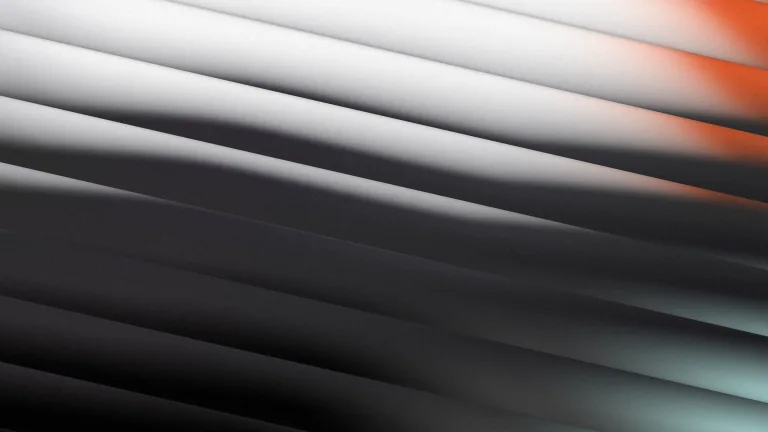 Charcoal and silver through diagonal glass, with mint and red fringes.