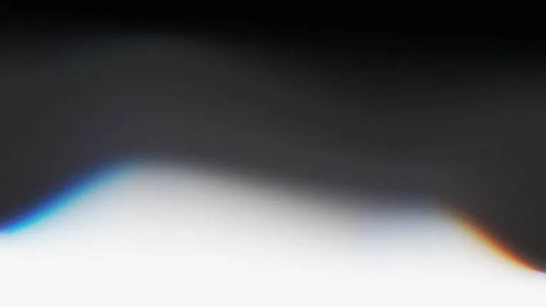 Cold Front: A deep graphite field opening into a soft white horizon.