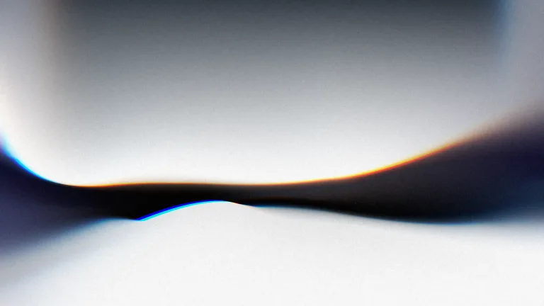 Silver folds around an ink-blue seam, edged with spectral light.